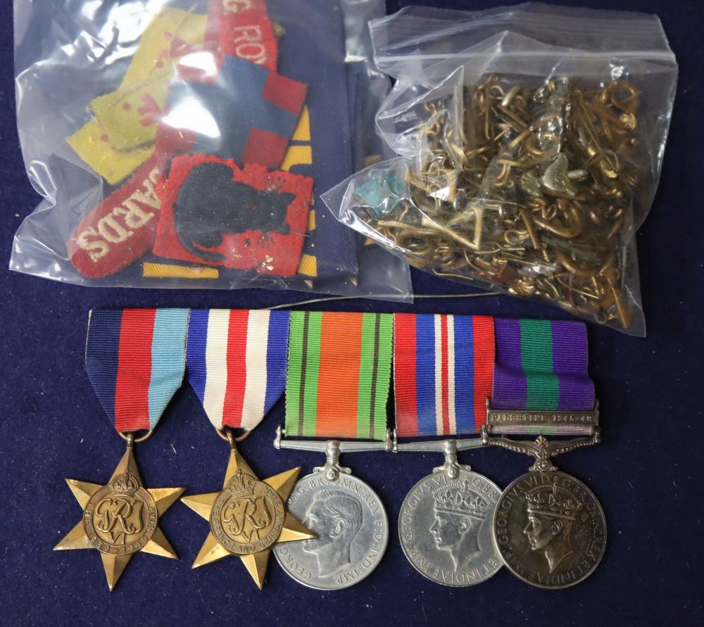 Two Burma medals, World War I sew on badges, a group of World War II medals and badges